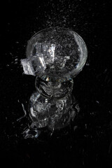 A splash with water and ice on a black background