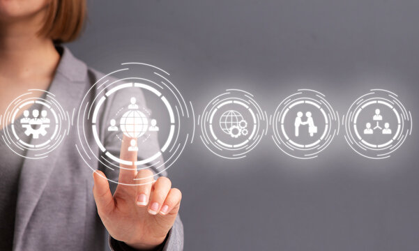 Human resource and management. Woman in business suit presses button on hologram on screen
