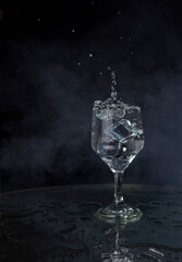 A splash with water and ice on a black background