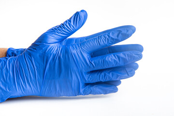 Hands wearing blue latex disposable gloves set on plain white background.