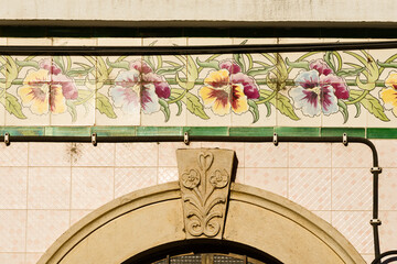 frieze of azulejos on a traditional facade in the Algarve