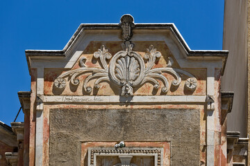 pediment of a ruined shipowner's building facade in Olhao, Algarve