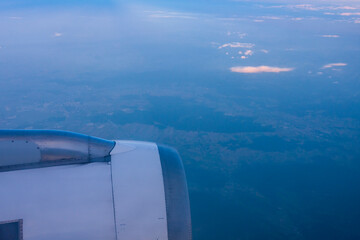 View from the window of airliner on the ground. Cloud clouds