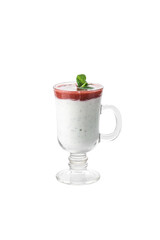 Delicious vanilla milkshake with strawberry topping and whipped cream in tall glass isolated on white background