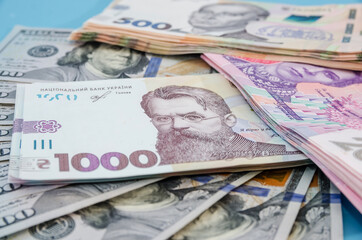 hryvnia and dollars on a blue background, money background. Much money. new banknotes.