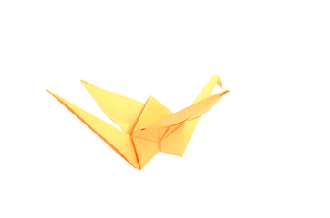 Naklejka premium A yellow origami bird flying over white