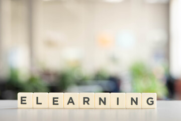 white blocks with elearning lettering on white desk