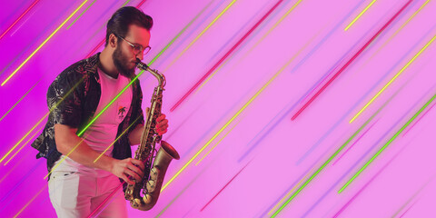 Musician with saxophone impovising. Creative portrait with copyspace. Neon lighted, colored...