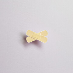 Band aid on purple background. medical concept. simple, minimal