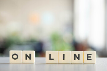 white blocks with on line lettering on white desk