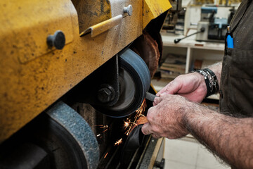 shoemaker man working in his shoe shop