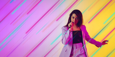 Woman singing, performing. Creative portrait with copyspace. Neon lighted, colored portrait with neon lines, flyer, proposal. Motion, action, youth culture concept. Contemporary art, modern design.