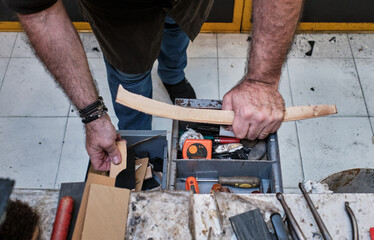shoemaker man working in his shoe shop