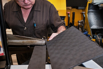 shoemaker man working in his shoe shop