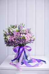 Purple Bridal bouquet decorated with ribbons