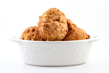 golden brown homemade oatmeal cookies isolated on white table