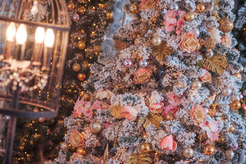 Decorated Christmas tree on blurred, sparkling and fairy background