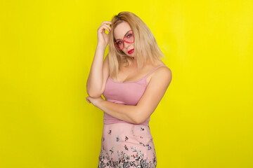 Blonde woman wearing sunglasses like hearts