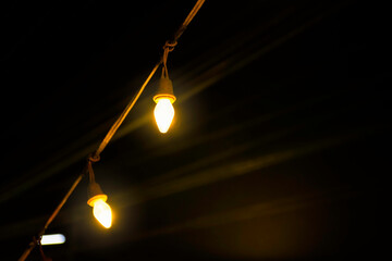 Hanging neon lamp light in the dark night