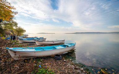 Naklejka na ściany i meble Fishing boats by the lake