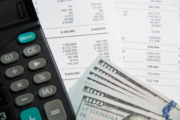 Fototapeta premium Financial statements, calculator and tables with income figures.