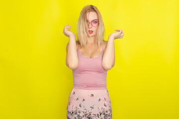 Blonde woman wearing sunglasses like hearts