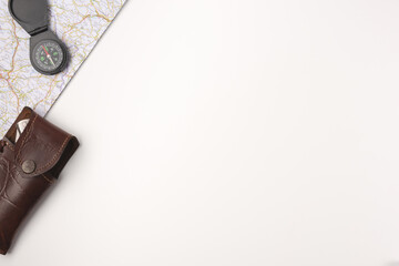 Traveler accessories. Map with compas and knife on white background with empty space for text © Konstantin Maslak