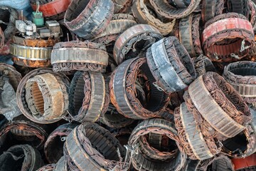 scrap yard of stator plate and wingdings in ac alternators for recycling. copper recycling from stator.