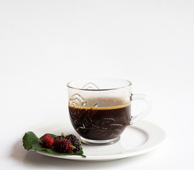 Cup of coffee with rose pattern,mulberry fruits on leaf,black and red mulberry fruits,cup of coffee with saucer,isolated on white background.