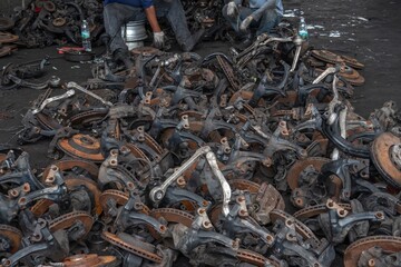 used brake rotor and car part at junkyard or scrapyard for recycling