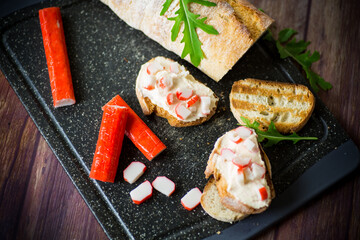 cheese sandwich and crab sticks on top