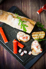 cheese sandwich and crab sticks on top