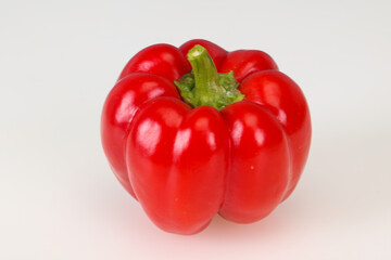 Ripe red bell pepper isolated on white