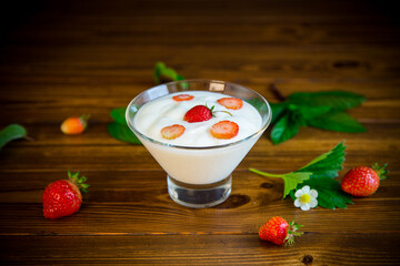 sweet homemade yogurt with red ripe fresh strawberries