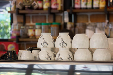 White coffee mug with coffee shop background