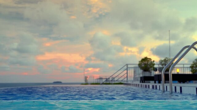 Paradise atmosphere, rooftop pool in the evening on the building
