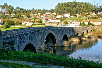 Fototapeta na wymiar Medieval bridge of Dom Zameiro on the Ave river, Portugal
