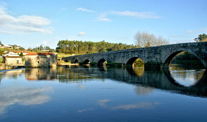 Fototapeta na wymiar Medieval bridge of Dom Zameiro on the Ave river, Portugal