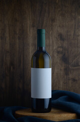 white wine bottle on wooden background