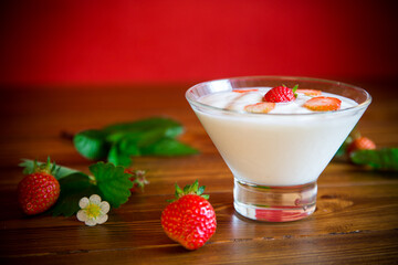 sweet homemade yogurt with red ripe fresh strawberries