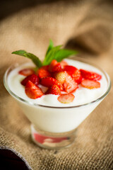sweet homemade yogurt with red ripe fresh strawberries