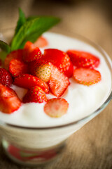 sweet homemade yogurt with red ripe fresh strawberries