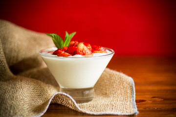 sweet homemade yogurt with red ripe fresh strawberries