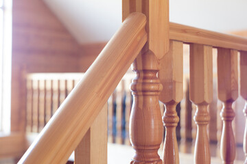 Element of wooden staircase made from pine in village light room to second floor