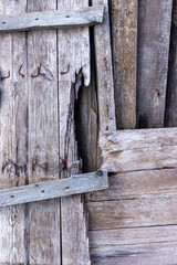 Background from old wooden boards. Old, gray boards fastened with rusty nails.