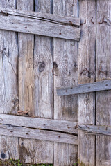 Background from old wooden boards. Old, gray boards fastened with rusty nails.