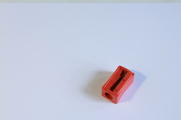 red pencil sharpener on a white table