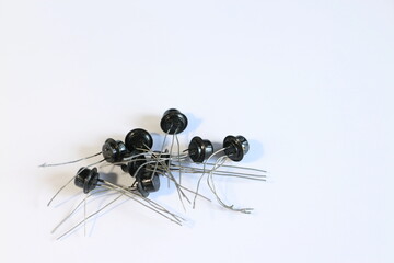 old electronic parts, transistors on a white background
