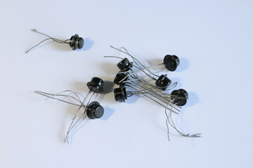old electronic parts, transistors on a white background