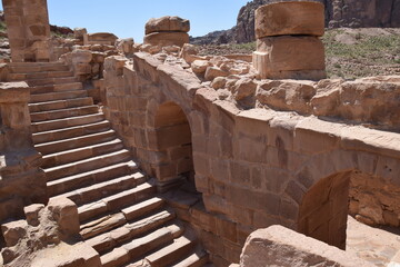 Obraz premium The ruins of the great temple with walls, stairs and columns in Petra, Wadi Musa, Jordan
